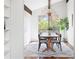 Bright dining room with hardwood floors, neutral tones, and a large view window at 210 Trailmore Ct, Roswell, GA 30076