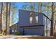 A modern two-story home with blue siding and an attached two-car garage at 210 Trailmore Ct, Roswell, GA 30076