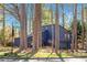 Stylish blue home at Trailmore Court with ample greenery and a well-maintained yard at 210 Trailmore Ct, Roswell, GA 30076