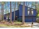 Charming contemporary home with beautiful blue siding and an attached two-car garage at 210 Trailmore Ct, Roswell, GA 30076
