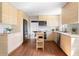 Spacious kitchen offers ample cabinetry, stainless steel appliances, and a functional island at 210 Trailmore Ct, Roswell, GA 30076