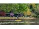 A Personal enjoys a leisurely ride on the lake, surrounded by the community's lush green spaces at 210 Trailmore Ct, Roswell, GA 30076
