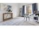 Home office with natural light, a modern desk, and blue accents at 210 Trailmore Ct, Roswell, GA 30076