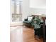 Cozy sitting area features comfortable armchairs, large window, and natural light at 210 Trailmore Ct, Roswell, GA 30076