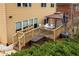 The back deck is accessible by a set of stairs and features a gazebo, lawn furniture, and an outdoor storage box at 5877 Stow Dr, Tucker, GA 30084