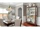Formal dining room featuring elegant decor, hardwood floors, and plenty of natural light at 5877 Stow Dr, Tucker, GA 30084