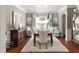 Formal dining room with elegant decor, stylish furniture, and a decorative chandelier at 5877 Stow Dr, Tucker, GA 30084