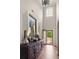 Elegant two-story foyer featuring stylish decor, hardwood floors, and lots of natural light at 5877 Stow Dr, Tucker, GA 30084