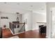 Cozy landing with hardwood floors, neutral paint, wood and iron railing and an oversized leather chair at 5877 Stow Dr, Tucker, GA 30084