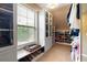 Organized walk-in closet with window, custom shelves, rods, and ample storage space at 5877 Stow Dr, Tucker, GA 30084