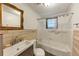 A well-lit bathroom with a modern sink and a shower-tub combination at 8065 Highway 92 Dallas, Douglasville, GA 30134