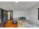 Neat bedroom with polished wood floors and neutral-colored walls at 8065 Highway 92 Dallas, Douglasville, GA 30134