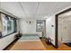 Cozy bedroom featuring two windows with curtains, and small tables at 8065 Highway 92 Dallas, Douglasville, GA 30134