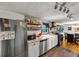 Open concept kitchen featuring stainless steel appliances, granite countertops, hardwood floors, and tile backsplash at 8065 Highway 92 Dallas, Douglasville, GA 30134
