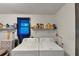 An efficient laundry room offers essential laundry appliances and storage shelving for supplies and convenience at 8065 Highway 92 Dallas, Douglasville, GA 30134