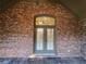 Exterior of a brick building with black tile porch and French doors at 120 Chastain Nw Rd # 1104, Kennesaw, GA 30144