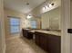 Bathroom featuring double vanity, granite countertop, and tile flooring at 120 Chastain Nw Rd # 1104, Kennesaw, GA 30144