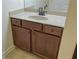 Bathroom vanity features granite countertop and traditional bronze fixtures at 120 Chastain Nw Rd # 1104, Kennesaw, GA 30144
