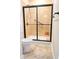 Tiled shower with glass doors, shower head, and tile flooring at 120 Chastain Nw Rd # 1104, Kennesaw, GA 30144
