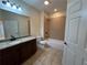 Bathroom featuring a granite countertop, tiled floors, and a shower over bath at 120 Chastain Nw Rd # 1104, Kennesaw, GA 30144
