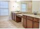 Bathroom featuring double vanity with granite countertops and wood cabinets at 120 Chastain Nw Rd # 1104, Kennesaw, GA 30144