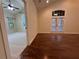 Bedroom featuring hardwood floors, ceiling fan, and doors to the outside at 120 Chastain Nw Rd # 1104, Kennesaw, GA 30144