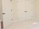 Spacious bedroom closet with bi-fold doors and dark bronze hardware at 120 Chastain Nw Rd # 1104, Kennesaw, GA 30144