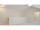 Light-colored bonus room featuring stairs and a bathroom doorway at 120 Chastain Nw Rd # 1104, Kennesaw, GA 30144