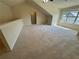Spacious bonus room with plush carpeting, a large window and vaulted ceiling at 120 Chastain Nw Rd # 1104, Kennesaw, GA 30144