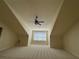 Bonus room showcasing vaulted ceiling with fan and large window at 120 Chastain Nw Rd # 1104, Kennesaw, GA 30144