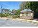 Exterior view of community pool house with bench seating nearby at 120 Chastain Nw Rd # 1104, Kennesaw, GA 30144