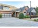 Charming brick home with a two-car garage, lush landscaping, and a screened-in porch at 120 Chastain Nw Rd # 1104, Kennesaw, GA 30144