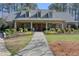 Charming home with a welcoming front porch, beautiful landscaping and flowering plants at 120 Chastain Nw Rd # 1104, Kennesaw, GA 30144