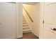 Hallway featuring stairs leading upwards and adjacent doors at 120 Chastain Nw Rd # 1104, Kennesaw, GA 30144