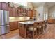 Well-appointed kitchen featuring granite countertops, wood cabinets, and stainless steel appliances at 120 Chastain Nw Rd # 1104, Kennesaw, GA 30144