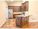 Kitchen with stainless steel appliances, granite counters, and hardwood floors at 120 Chastain Nw Rd # 1104, Kennesaw, GA 30144
