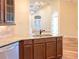 Open concept kitchen with granite countertops and stainless steel appliances adjacent to living area at 120 Chastain Nw Rd # 1104, Kennesaw, GA 30144