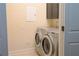 This laundry room features side by side washer and dryer at 120 Chastain Nw Rd # 1104, Kennesaw, GA 30144