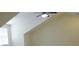 Living room with vaulted ceiling and ceiling fan near a window at 120 Chastain Nw Rd # 1104, Kennesaw, GA 30144