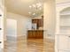 Open-concept living area with hardwood floors and kitchen island at 120 Chastain Nw Rd # 1104, Kennesaw, GA 30144