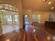 Spacious open-concept living area with hardwood floors, high ceilings, and plenty of natural light at 120 Chastain Nw Rd # 1104, Kennesaw, GA 30144