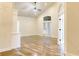 Spacious living room featuring hardwood floors, high ceilings, and French doors for abundant natural light at 120 Chastain Nw Rd # 1104, Kennesaw, GA 30144