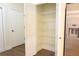 Well-organized pantry with wire shelving for ample storage space, located next to stainless steel refrigerator at 120 Chastain Nw Rd # 1104, Kennesaw, GA 30144