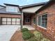 Brick exterior with a covered patio and attached garage offers both style and convenience at 120 Chastain Nw Rd # 1104, Kennesaw, GA 30144