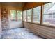 Cozy sunroom featuring large windows, neutral siding, and slate tile floor at 120 Chastain Nw Rd # 1104, Kennesaw, GA 30144