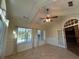 Relaxing sunroom with tile flooring, many windows, and a ceiling fan at 120 Chastain Nw Rd # 1104, Kennesaw, GA 30144