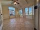 Inviting sunroom with neutral tile flooring, large windows, and tongue-and-groove ceiling at 120 Chastain Nw Rd # 1104, Kennesaw, GA 30144