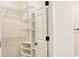 Spacious walk-in closet featuring built-in shelving and ample storage space at 120 Chastain Nw Rd # 1104, Kennesaw, GA 30144