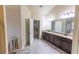 Large bathroom with double vanities, granite countertops, and ample cabinet space at 1960 Overlook Springs Ln, Cumming, GA 30040