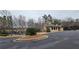Community clubhouse with parking, playground, and outdoor recreation areas at 1960 Overlook Springs Ln, Cumming, GA 30040